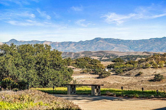 mountain view featuring a rural view