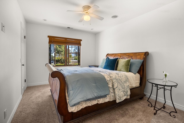 bedroom with ceiling fan and carpet floors