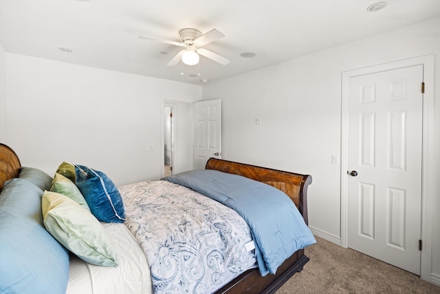 carpeted bedroom with ceiling fan