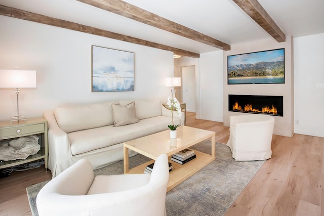 living room featuring beam ceiling and wood-type flooring