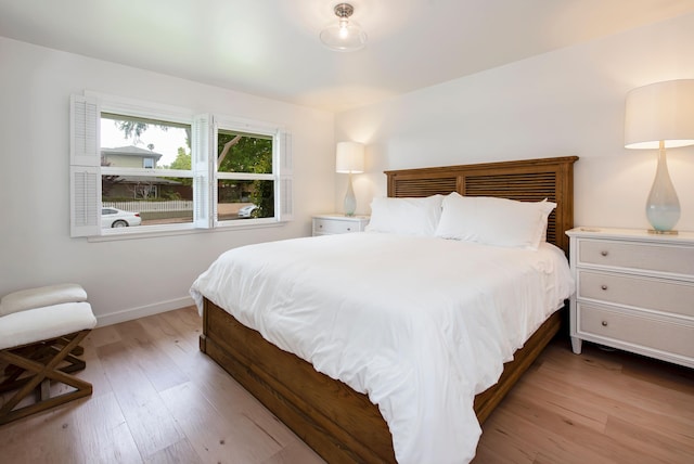 bedroom with light wood-type flooring