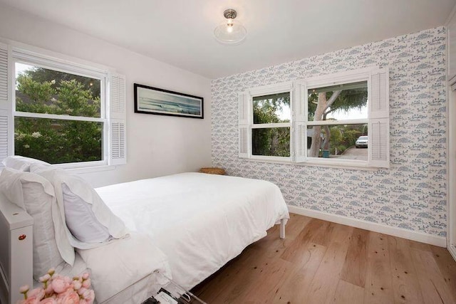 bedroom with wood-type flooring