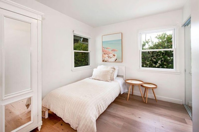 bedroom with light hardwood / wood-style flooring