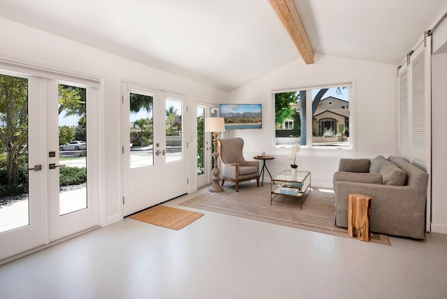 sunroom / solarium with a barn door, french doors, and lofted ceiling with beams