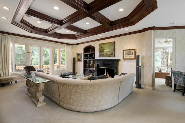 carpeted living room with french doors, beamed ceiling, ornamental molding, ceiling fan, and coffered ceiling