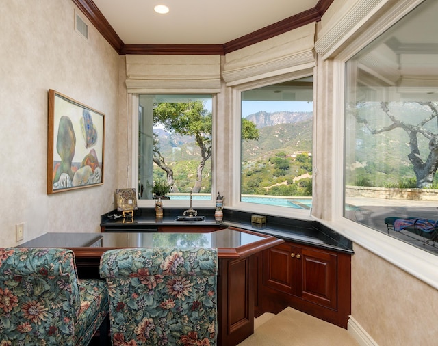 office with ornamental molding and a mountain view