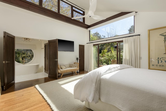 bedroom featuring ceiling fan, high vaulted ceiling, and hardwood / wood-style floors