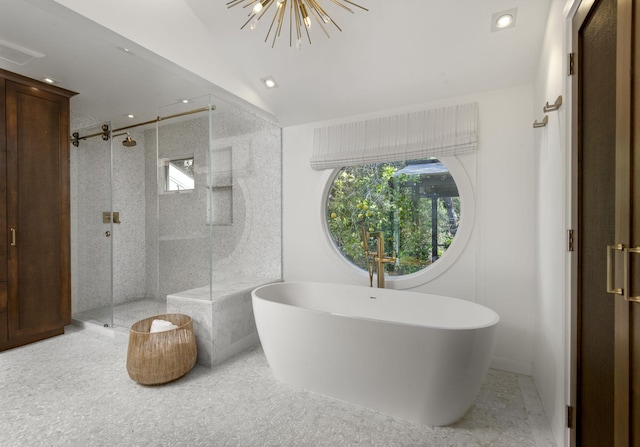 bathroom featuring shower with separate bathtub, vaulted ceiling, and a notable chandelier