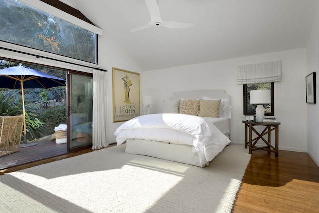 bedroom with hardwood / wood-style floors, vaulted ceiling, access to outside, and ceiling fan