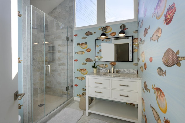 bathroom with vanity, tile patterned flooring, and a shower with shower door