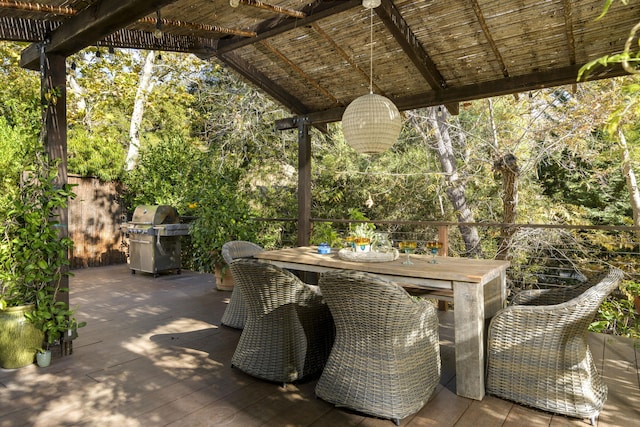 view of patio with a grill and a deck