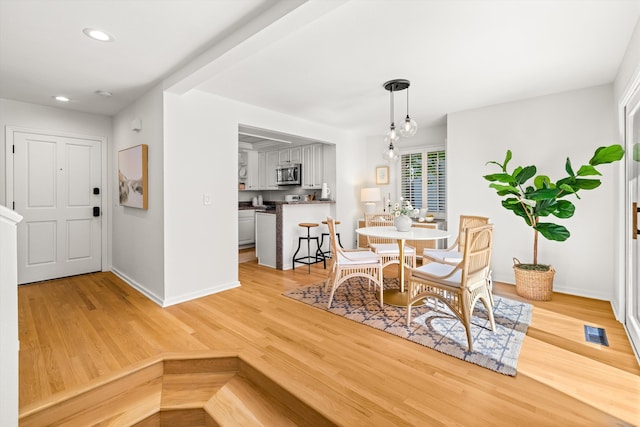 dining space featuring light hardwood / wood-style floors