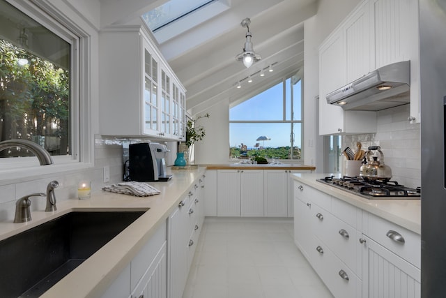 kitchen featuring white cabinetry, stainless steel gas cooktop, and sink