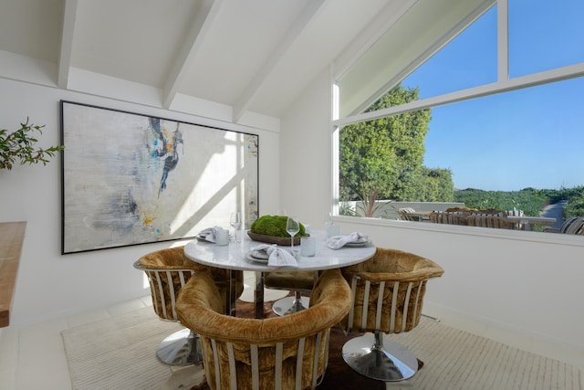 interior space featuring vaulted ceiling with beams