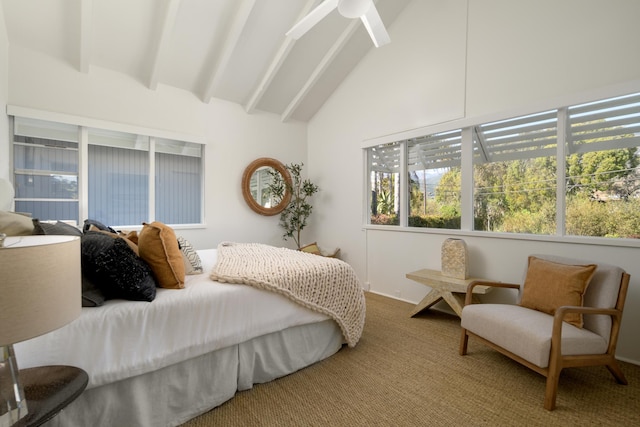 carpeted bedroom featuring ceiling fan and lofted ceiling with beams