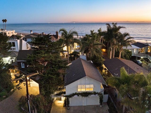 aerial view at dusk with a water view