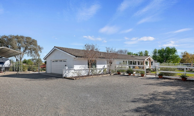 single story home with a carport and a garage