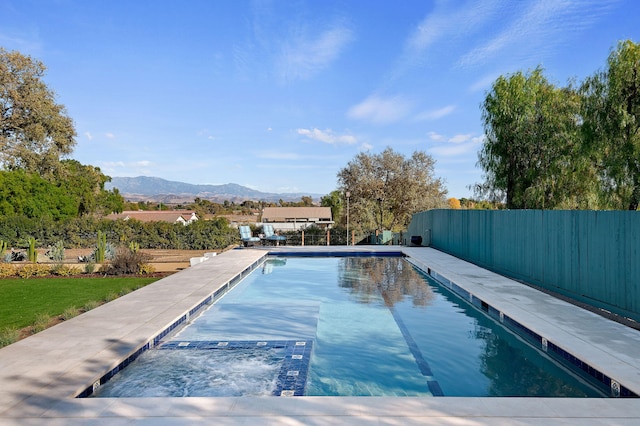 view of swimming pool featuring a mountain view