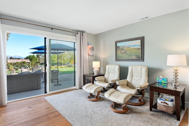 living area with light hardwood / wood-style floors