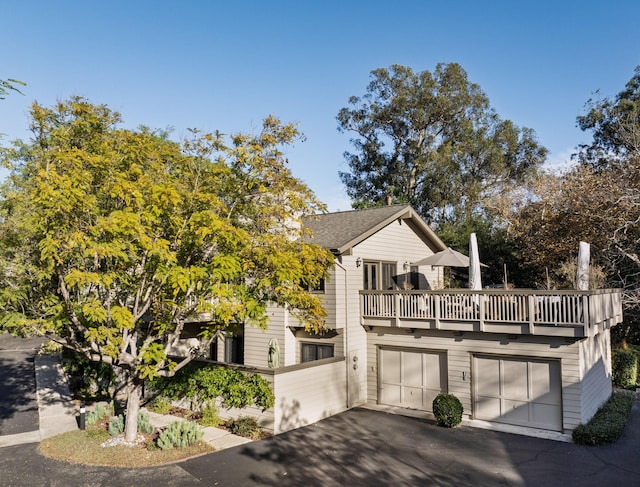 view of front of house with a balcony and a garage