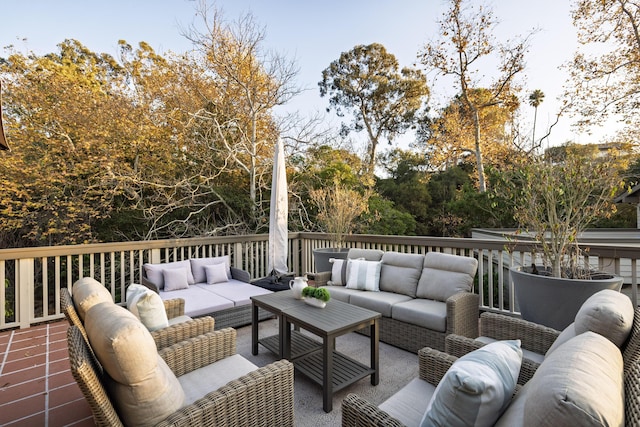 wooden terrace with an outdoor hangout area