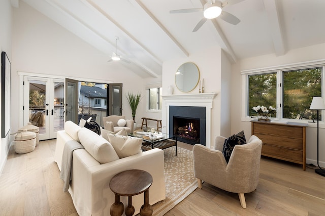 living room with french doors, ceiling fan, high vaulted ceiling, light hardwood / wood-style flooring, and beamed ceiling