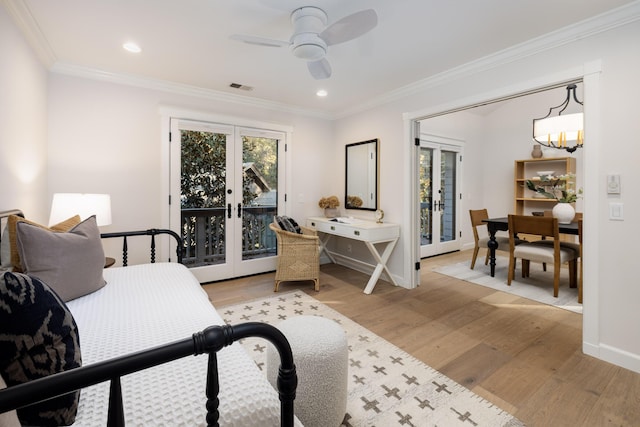 bedroom with access to exterior, ceiling fan, french doors, light hardwood / wood-style flooring, and crown molding