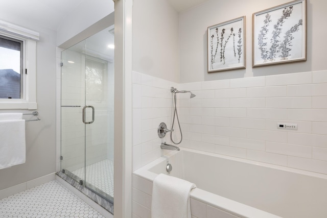 bathroom with separate shower and tub