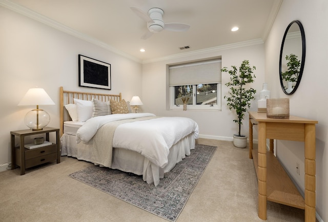 carpeted bedroom featuring ceiling fan and ornamental molding