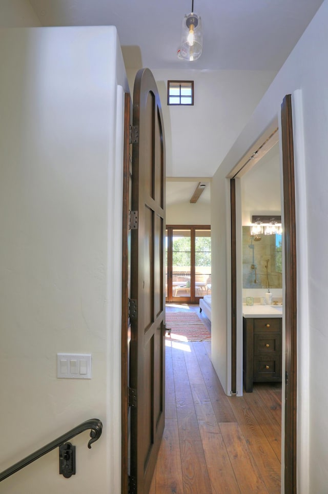 hallway with french doors and light wood-type flooring