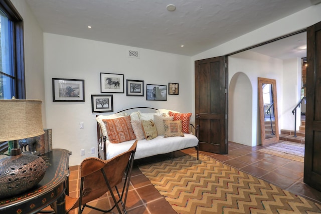 sitting room with dark tile patterned flooring