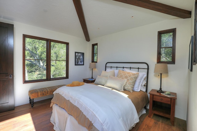 bedroom featuring beam ceiling and dark hardwood / wood-style flooring