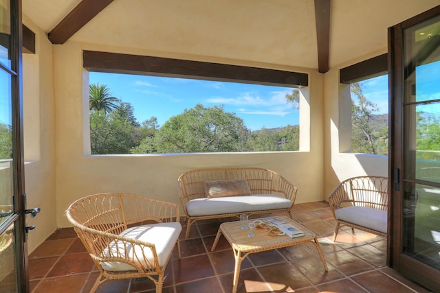 sunroom with beam ceiling