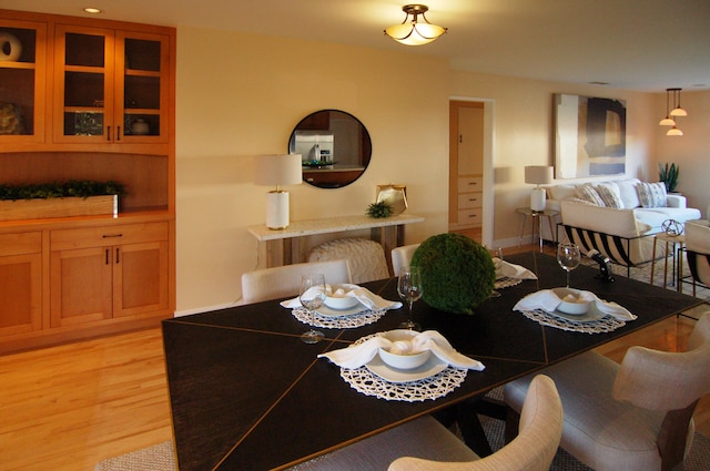 dining area with light hardwood / wood-style flooring