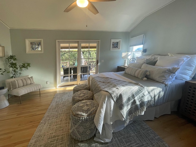 bedroom with access to exterior, hardwood / wood-style flooring, vaulted ceiling, and ceiling fan