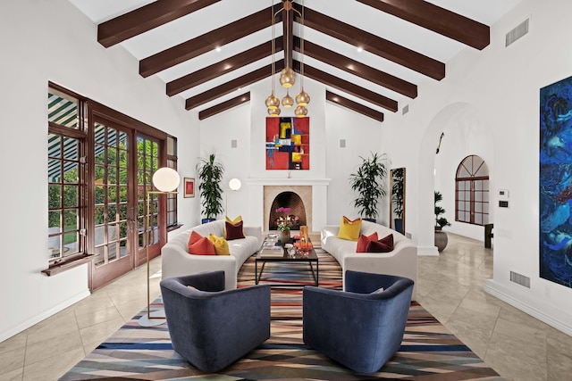 tiled living room with beam ceiling, french doors, high vaulted ceiling, and an inviting chandelier