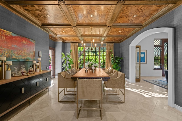 dining area with beam ceiling, crown molding, and coffered ceiling