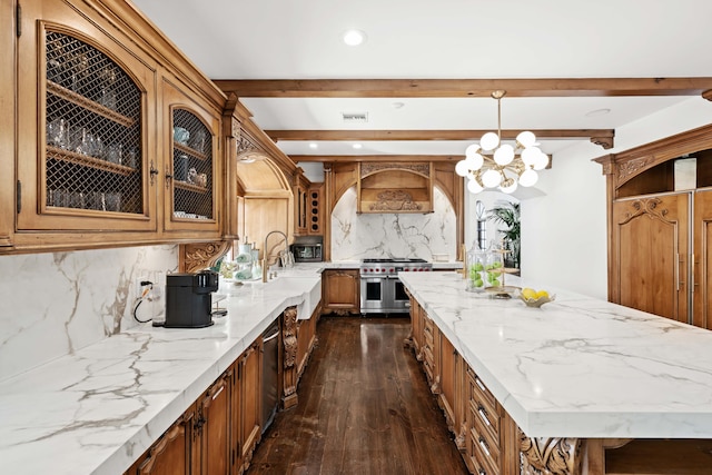 kitchen with decorative light fixtures, tasteful backsplash, a notable chandelier, dark hardwood / wood-style flooring, and stainless steel appliances