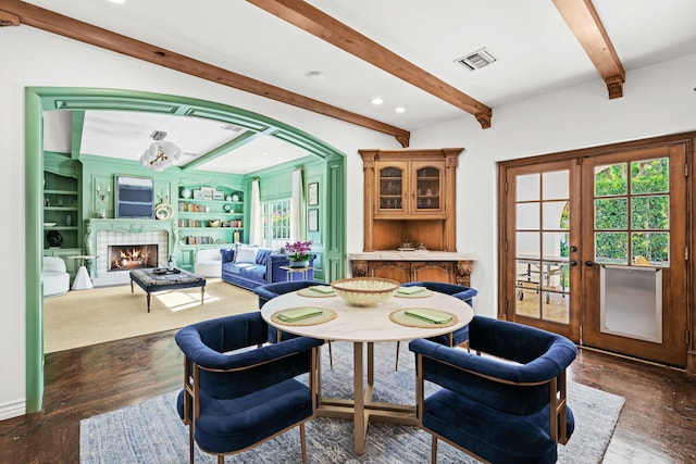 dining area with beam ceiling, built in shelves, french doors, and a notable chandelier