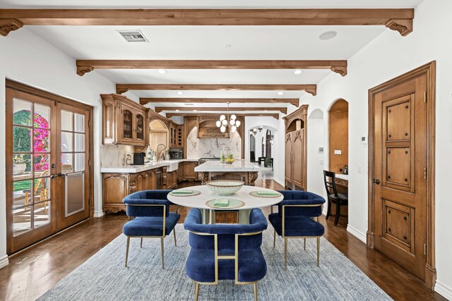 dining area with a chandelier, french doors, dark hardwood / wood-style flooring, and beam ceiling