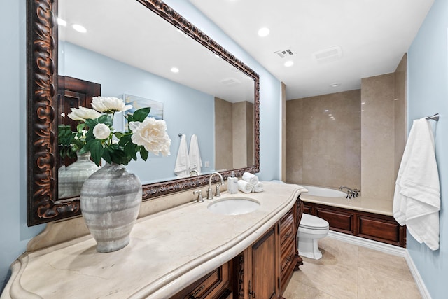 bathroom featuring tile patterned flooring, a bath, vanity, and toilet