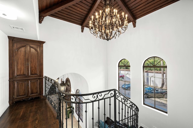 corridor featuring wood ceiling, high vaulted ceiling, a notable chandelier, beamed ceiling, and dark hardwood / wood-style floors