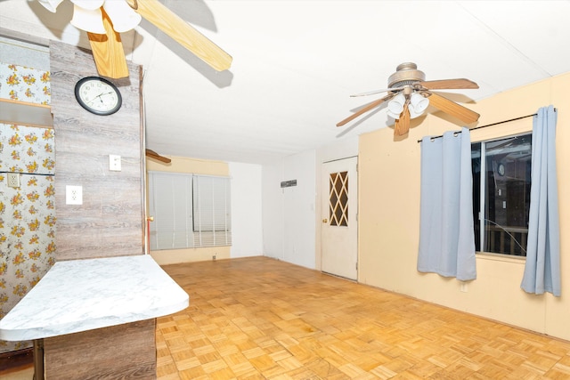 spare room featuring ceiling fan and light parquet floors