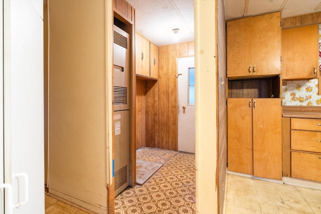 interior space featuring wood walls