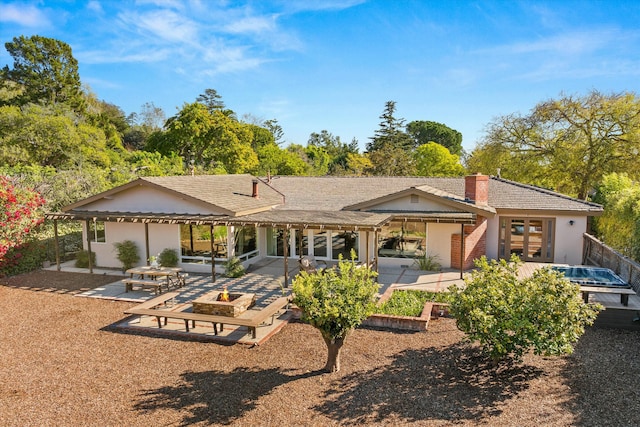 back of property featuring a patio area and french doors