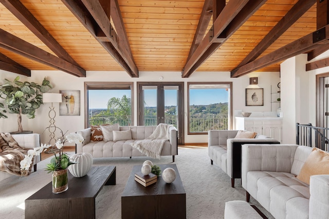 living room featuring wooden ceiling, carpet flooring, french doors, and vaulted ceiling with beams