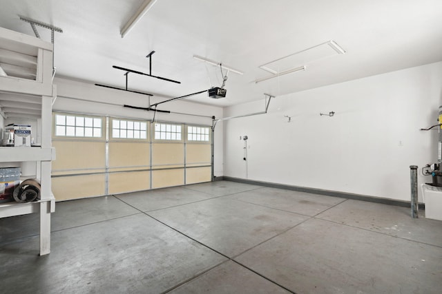 garage featuring baseboards and a garage door opener