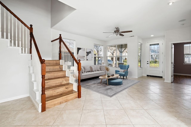 living room with baseboards, a ceiling fan, stairway, light tile patterned flooring, and recessed lighting