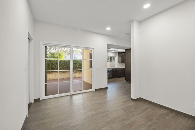 spare room with hardwood / wood-style floors