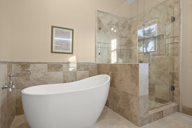 bathroom with plus walk in shower and tile walls